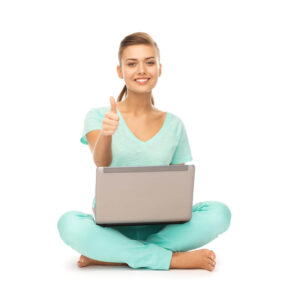young-girl-sitting-on-the-floor-with-laptop-showing-thumbs-up